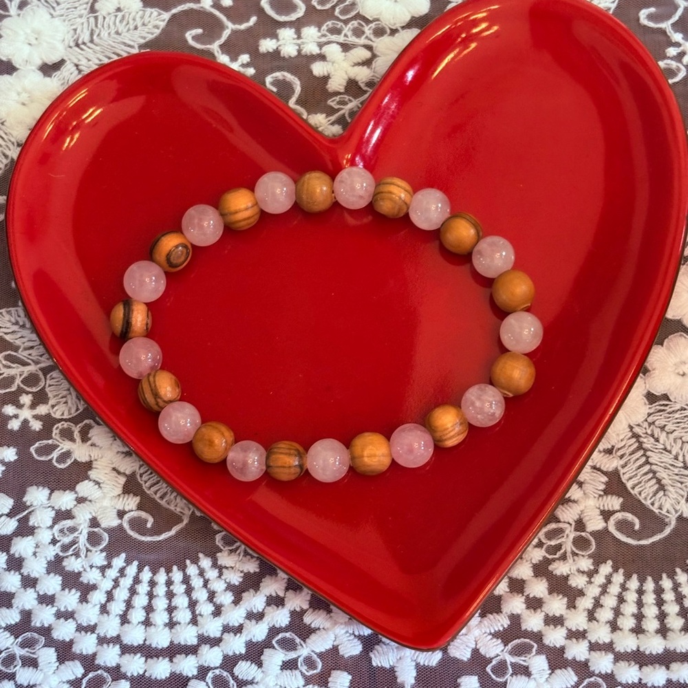 Fath- Wood from Bethlehem paired with a rose quartz bracelet.